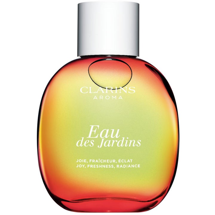 Clarins Eau Des Jardins 100 ml parfymspray som ger lyster i rundad glasflaska med röd och grön färgövergång och silverkork