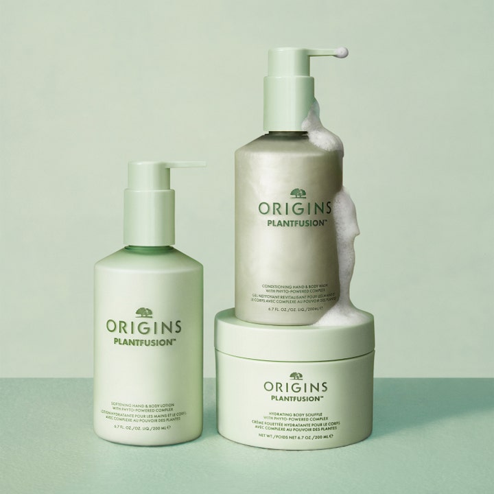 Origins Plantfusion Softening Hand & Body Lotion 75 ml botanisk kroppslotion för torr hud i ljusgröna flaskor med vitt skum.