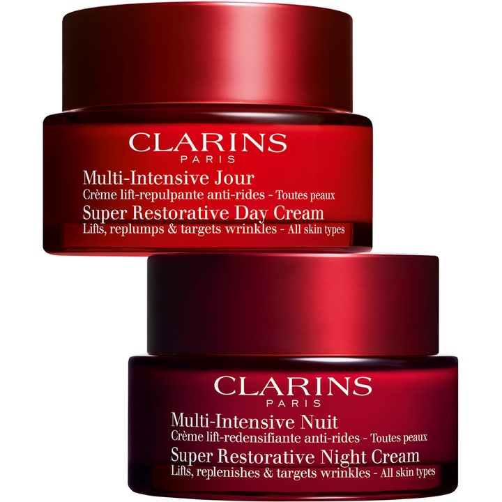 Clarins Super Restorative Night Cream 50 ml lyftande nattkräm och dagkräm i två eleganta röda glasburkar.