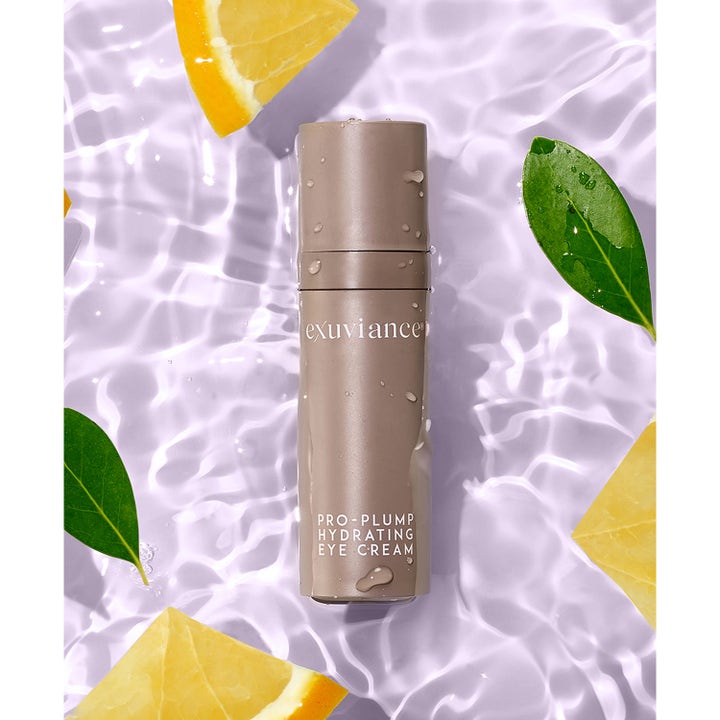 Exuviance Pro-Plump Hydrating Eye Cream 15 g återfuktande ögonkräm i beige tub bland vatten och citroner