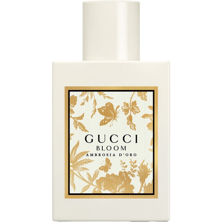 Gucci Bloom Ambrosia d'Oro 50 ml parfym i krämvit rektangulär flaska med guldigt blommönster på etiketten