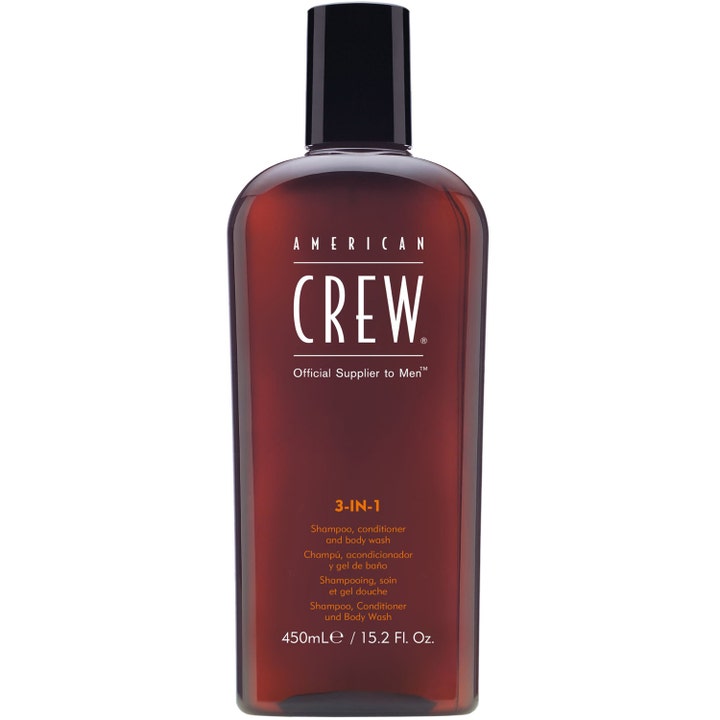 American Crew 3-IN-1 450ml duschschampo och herrtvål som ger ren hud i en bärnstensfärgad plastflaska med svart lock.
