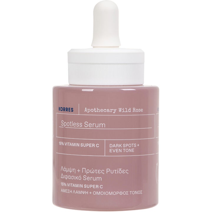 Korres Apothecary Wild Rose Spotless Serum högkoncentrerat vitamin c serum i en rosa glasflaska med vit pipett