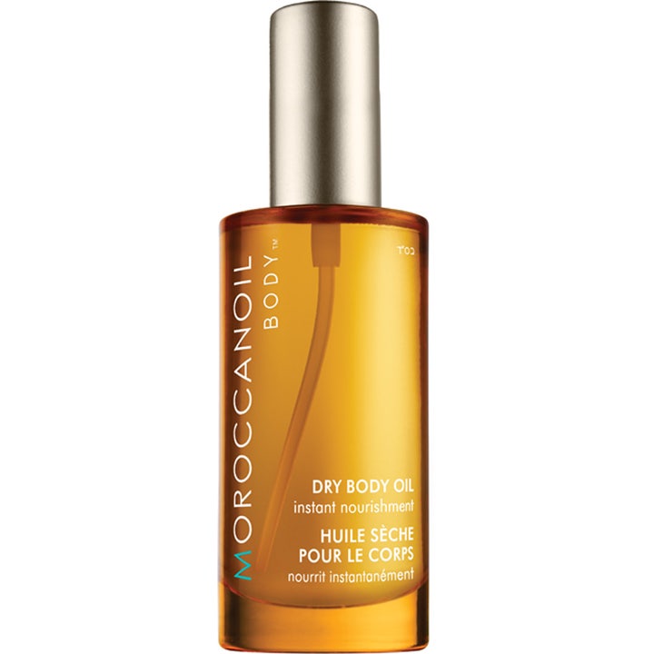 Moroccanoil Dry Body Oil kroppsolja för torr hud med argan i bärnstensfärgad glasflaska med silverlock ger näring.