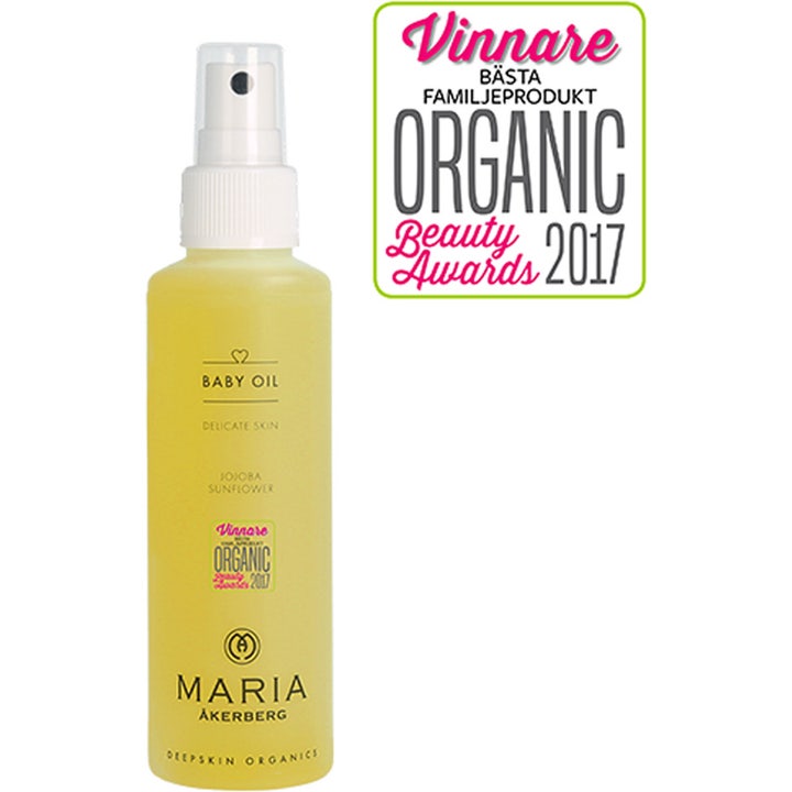 Maria Åkerberg Baby Oil 125 ml mjukgörande ekologisk babyolja för spädbarn i genomskinlig sprayflaska med gul olja.