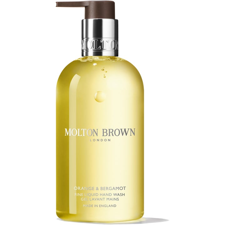 Molton Brown Orange & Bergamot 300 ml lyxig flytande handtvål med gul gel i genomskinlig flaska med silverpump.