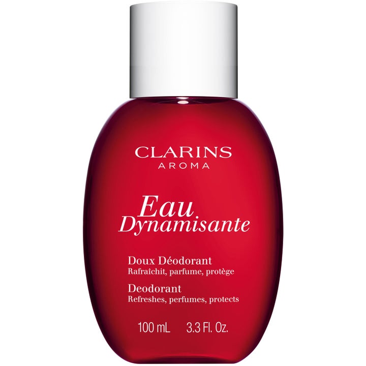 Clarins Eau Dynamisante 100 ml skyddande deodorant i en elegant röd rundad glasflaska med ett blankt silverlock.