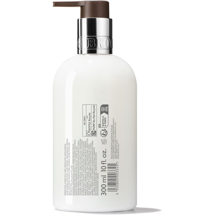 Molton Brown Rose Dunes 300 ml lyxig bodylotion för torr hud i vit flaska med text på baksidan.