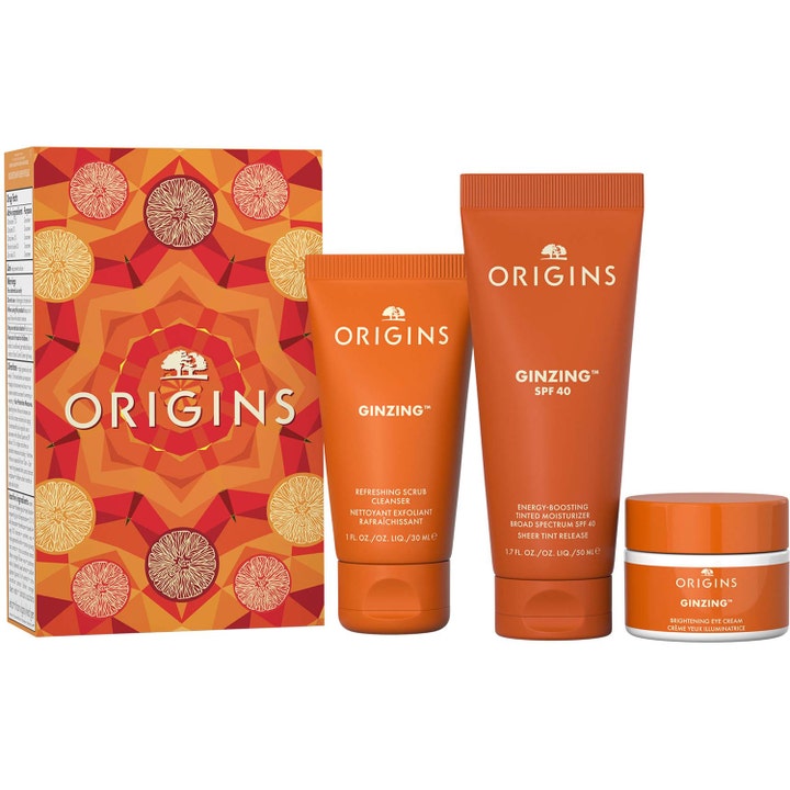Origins Ginzing hudvård presentförpackning med brightening solskydd ansikte och energigivande ögonkräm i orange tuber.