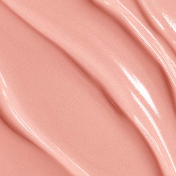 Biotherm Collagen Fit Body Cream 200 ml uppstramande kroppskräm i vit burk som hålls upp av en hand