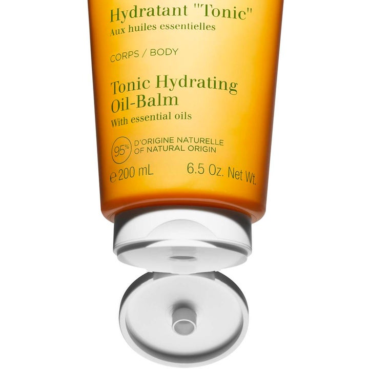 Clarins Hydrating Toning Body Balm 200 ml återfuktande body lotion i orange tub med öppet vitt lock.