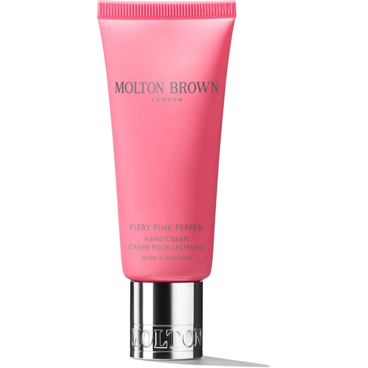 Molton Brown Fiery Pink Pepper handkräm 40 ml mjukgör händerna i en klarrosa tub med glänsande silverlock