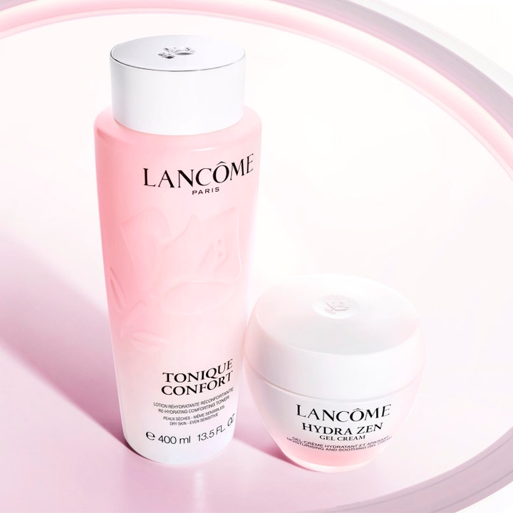 Lancôme Tonique Confort 400 ml återfuktande toner i rosa flaska bredvid en vit Hydra Zen ansiktskräm.
