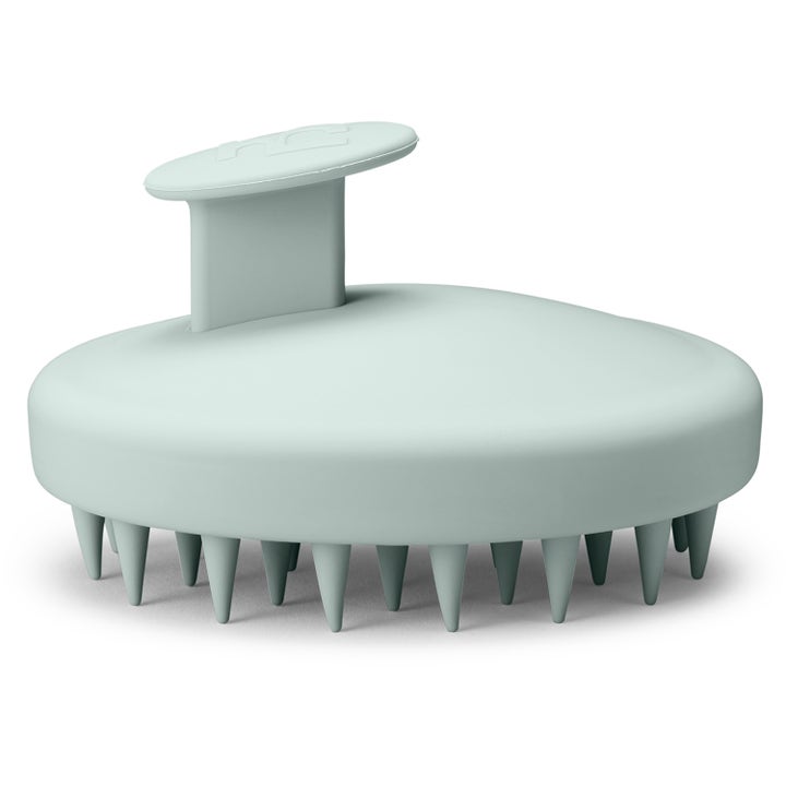 Hickap Scalp Massage Brush 1 st för skonsam hårvård med mjuka silikonpiggar i en ljust mintgrön nyans.