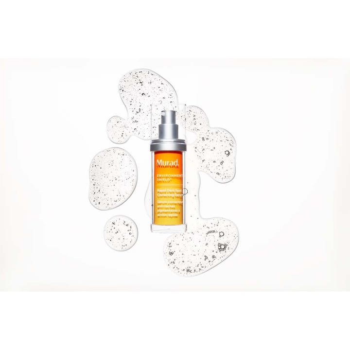 Murad Environmental Shield Rapid Dark Spot Correcting Serum 30 ml mot pigmentering ansikte i orange flaska med klar textur.