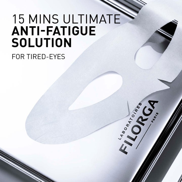 Filorga Optim-Eyes Eye Mask 6 ml ögonmask mot påsar visar en vit arkmask på silver med texten anti-fatigue.