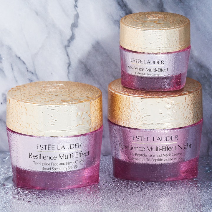 Estée Lauder Resilience Multi-Effect 50 ml antiåldrande ansiktskräm i rosa glasburkar med guldlock och vattendroppar