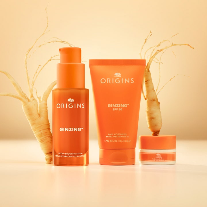 Origins GinZing Into the Glow Serum 30 ml ger lyster med ginsengrötter i en lyxig orange glasflaska.