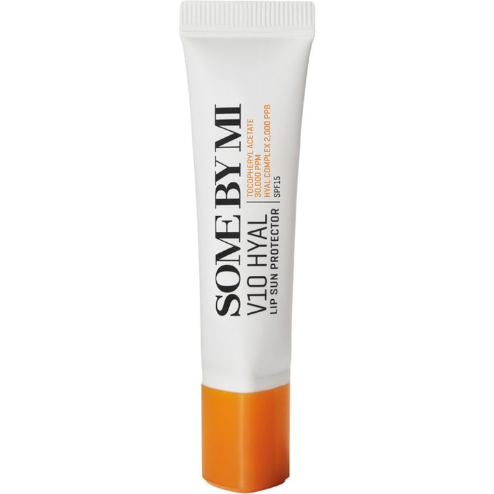 SOME BY MI V10 Hyal Lip Sun Protector fuktgivande läppbalsam med solskydd och hyaluronsyra i vit tub med orange lock