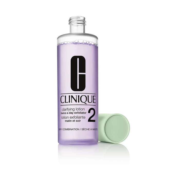 Clinique Clarifying Lotion 2 200 ml exfolierande toner i genomskinlig flaska med lila vätska och ljusgrönt lock