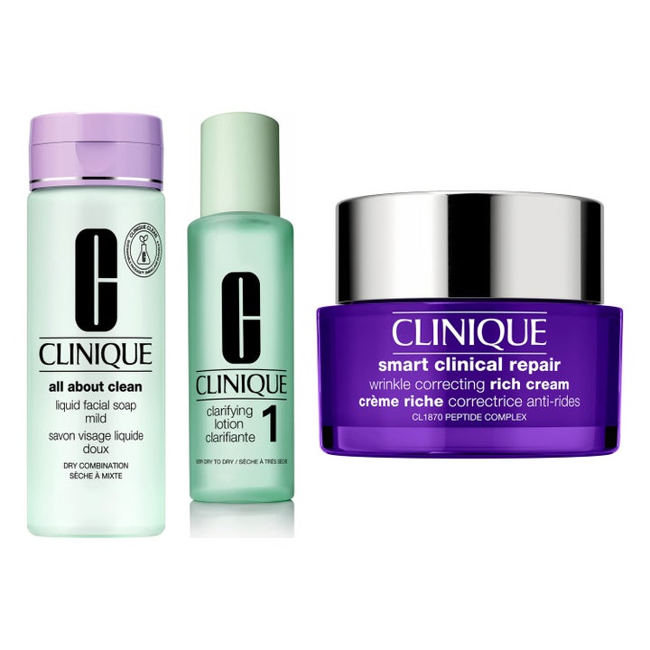Clinique Smart Clinical Repair hudvårdskit som ger slätare hy med lila krämburk och två mintgröna flaskor.