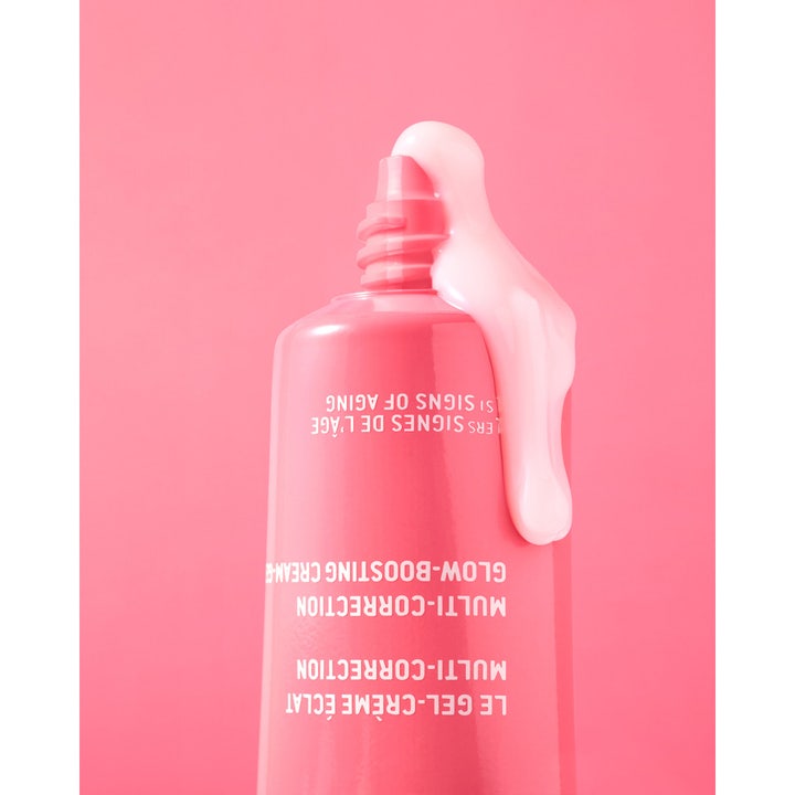 Nuxe Créme Prodigieuse Boost 40 ml ansiktskräm för lyster med ljusrosa gelkräm som rinner ur en rosa tub.