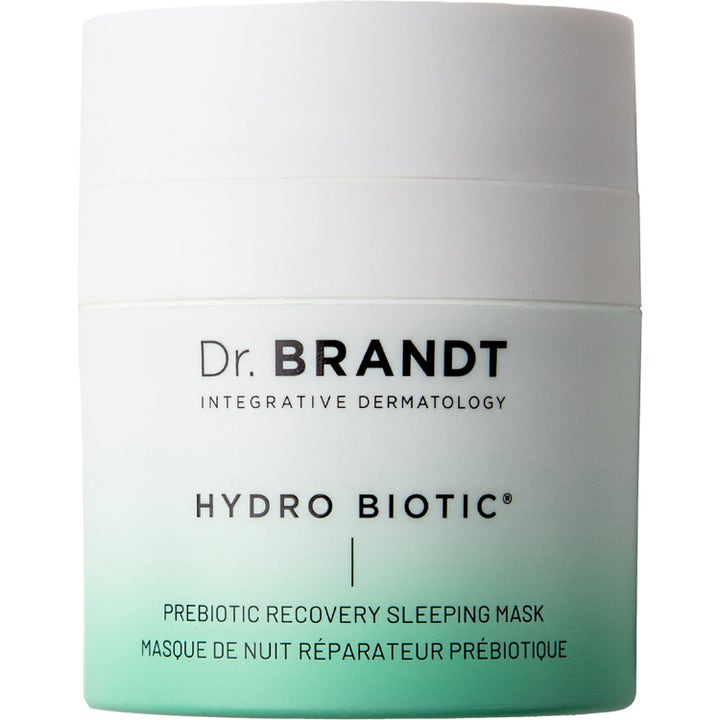 Dr. Brandt Hydro Biotic Prebiotic Recovery Sleeping Mask nattmask med prebiotika i vit burk med grön tonad botten.