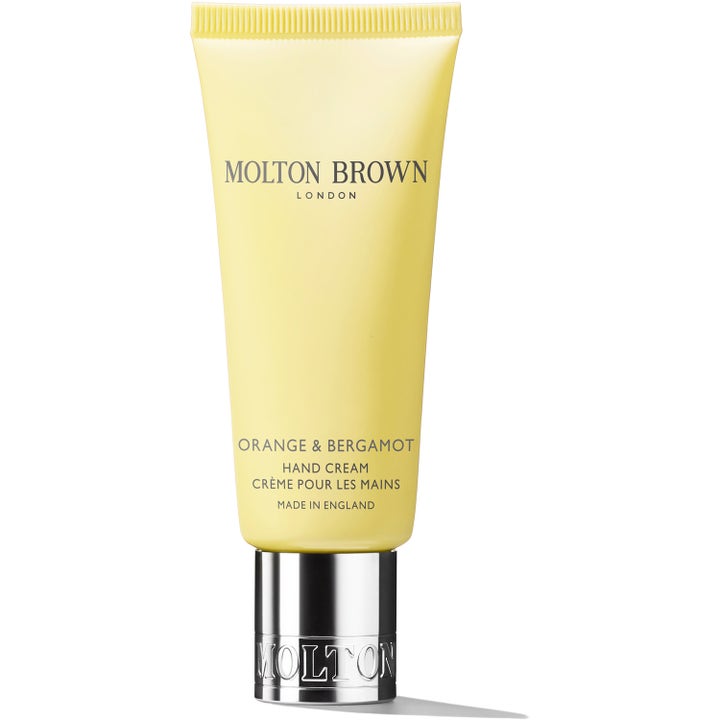 Molton Brown Orange & Bergamot återfuktande handkräm citrus i en ljusgul tub med graverad silverkork.