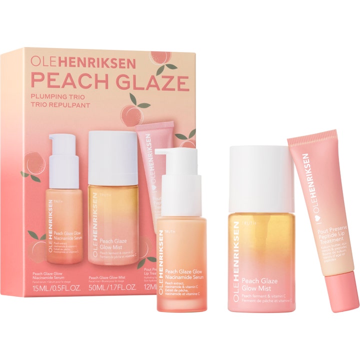 Olehenriksen Peach Glaze Plumping Trio 3 delar lystergivande hudvårdsset med niacinamid i persikofärgade flaskor och tub