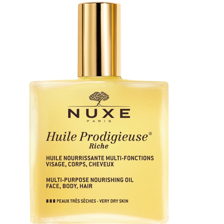 Nuxe Huile Prodigieuse Riche ansiktsolja mycket torr hud ger intensiv näring i en fyrkantig glasflaska med guldlock.