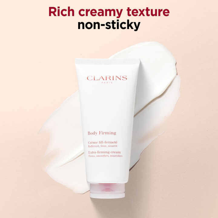 Clarins Body Firming 200 ml anti-aging uppstramande kräm i vit tub framför fyllig krämig textur som inte kladdar.