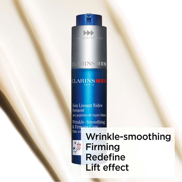 Clarins Clarins Men Wrinkle-Smoothing & Firming Care 50 ml uppstramande ansiktskräm i blå pumpflaska mot krämig vit textur