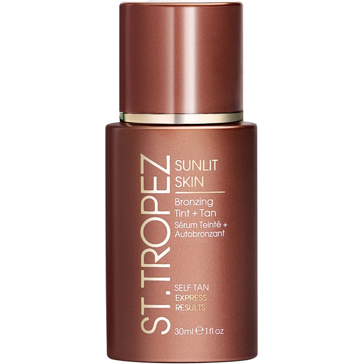 St. Tropez Sunlit Skin Bronzing Tint + Tan 30 ml express flytande bronzer i lyxig metallisk brun flaska med gulddetaljer