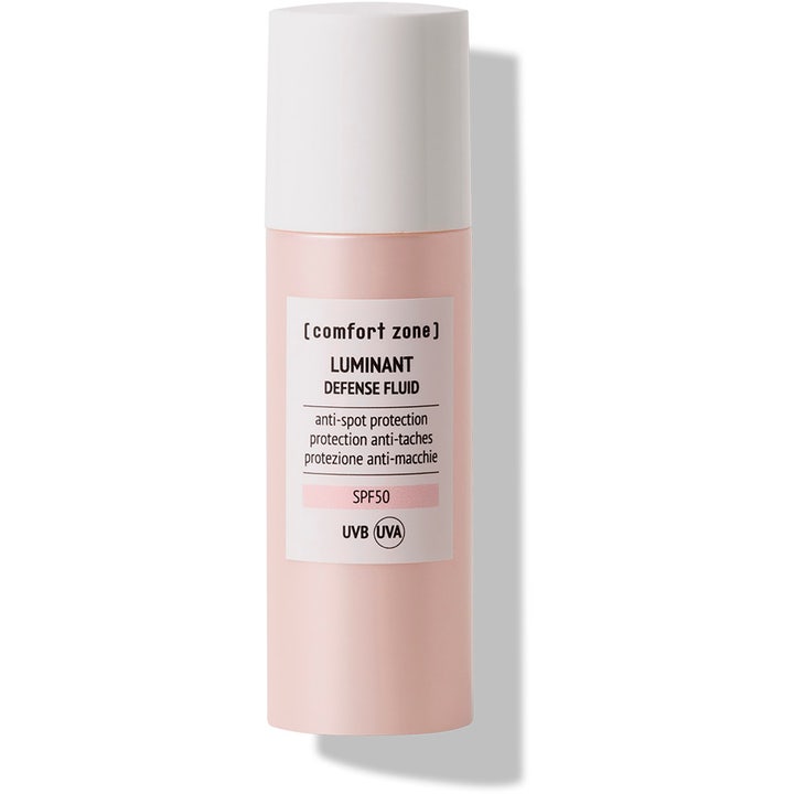 [comfort zone] Luminant Defense Fluid ansiktssolkräm mot pigmentfläckar spf50 i en ljusrosa flaska med vitt lock
