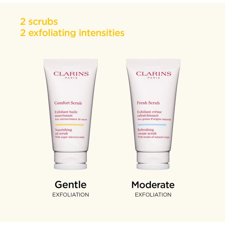 Clarins Comfort Scrub 50 ml närande ansiktsskrubb i vit tub bredvid Fresh Scrub för skonsam exfoliering