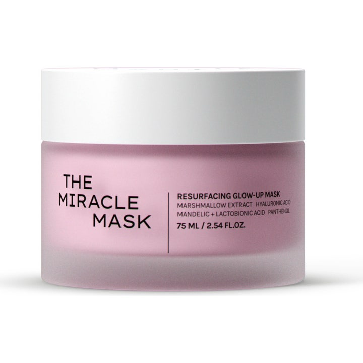 The Miracle Mask 75 ml exfoliering ansiktsbehandling och acid glow mask i frostad rosa glasburk med vitt lock.