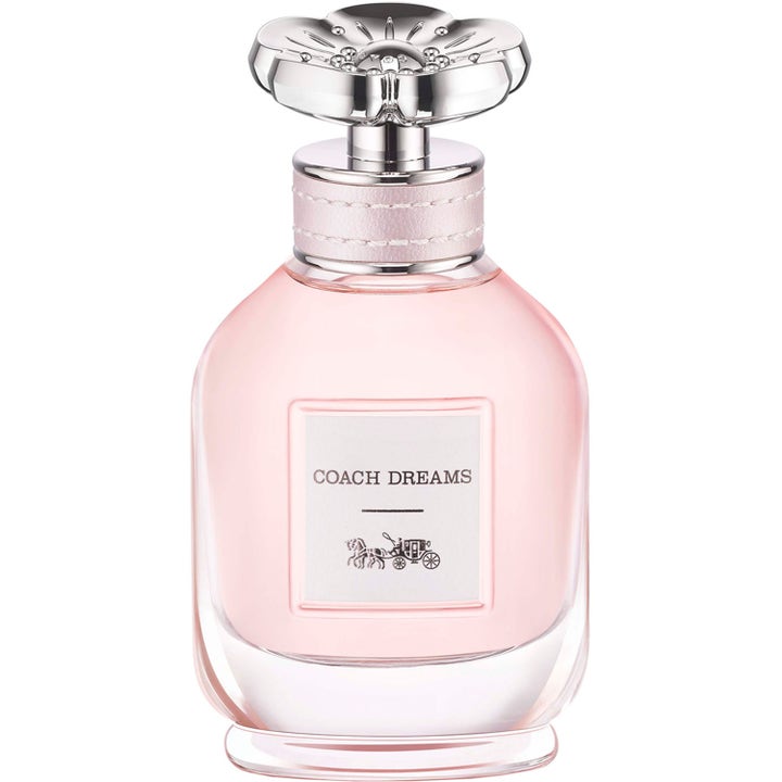 Coach Dreams 40 ml eau de parfum dam i en rund glasflaska med rosa vätska och ett silverlock format som en blomma
