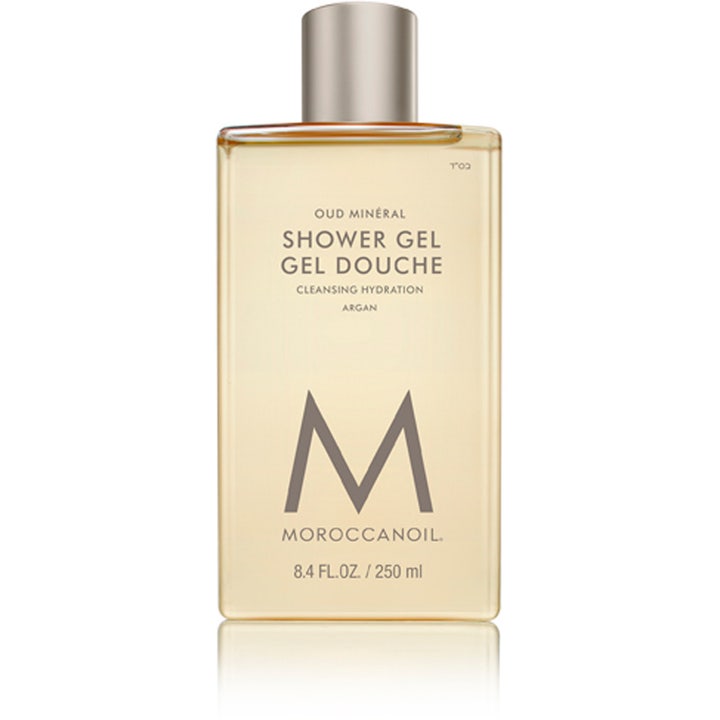 Moroccanoil Oud Minéral 250 ml argan oud duschgel för män i genomskinlig flaska med silverkork och gyllene gel.