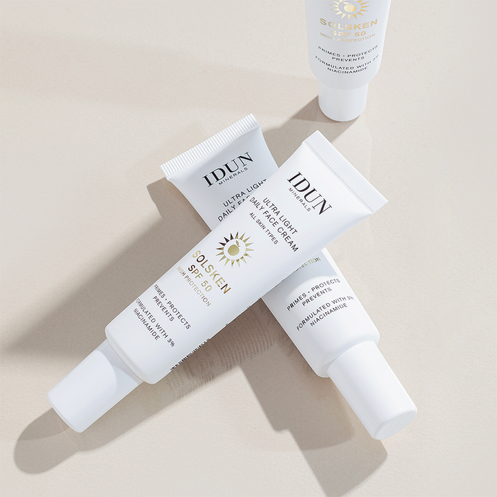 IDUN Minerals Ultra Light Daily Face Cream Solsken SPF50 30 ml solkräm för ansiktet i vita tuber med niacinamid