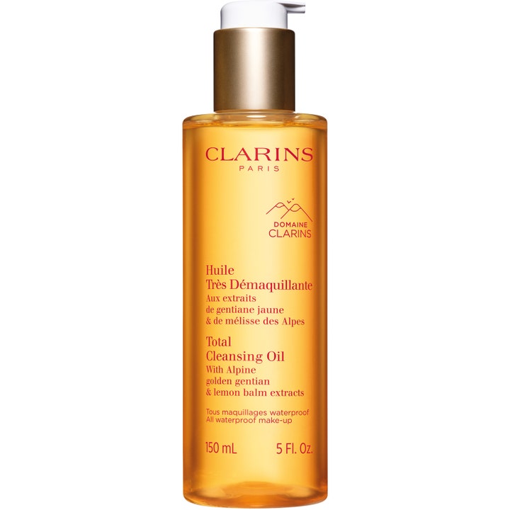 Clarins Total Cleansing Oil 150 ml rengöringsolja ansikte för sminkborttagning i gul transparent flaska med vit pump