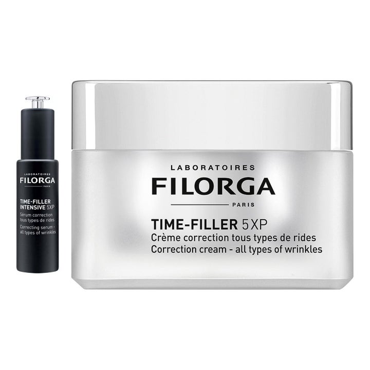 Filorga Time-Filler set för rynkborttagning med time-filler kräm i vit burk och serum i glasflaska med öppen pipett.