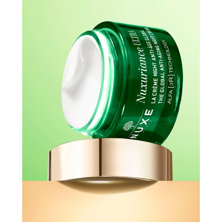 Nuxe Nuxuriance Gold Night Balm 184 g närande anti-age balm med fyllig vit kräm i grön glasburk.