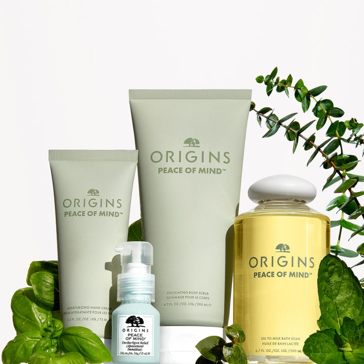 Origins Peace Of Mind On The Spot Relief 15 ml punktbehandling för avslappning bland gröna blad och hudvårdstuber