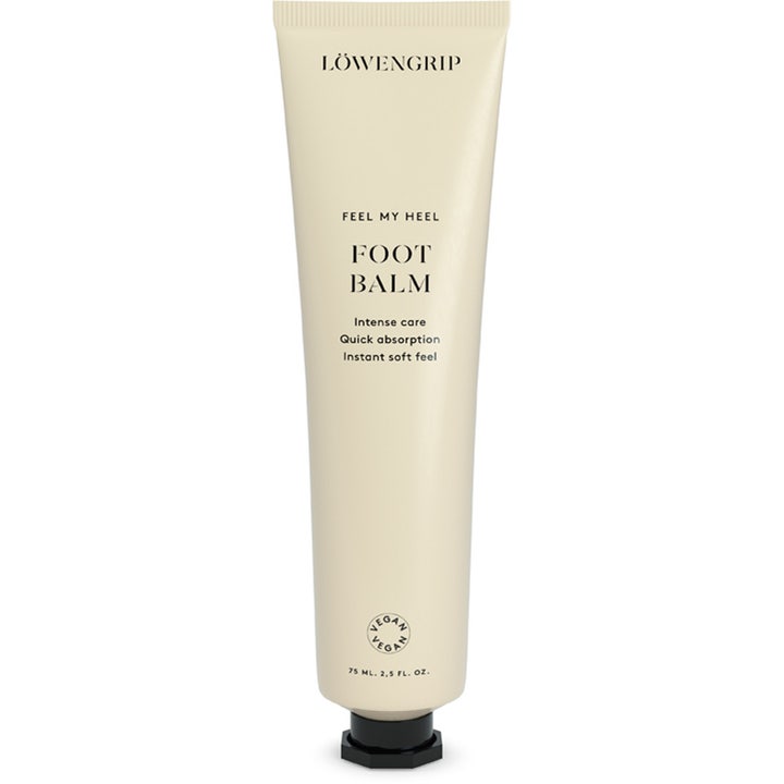 Löwengrip Feel My Heel Foot Balm 75 ml mjukgörande fotvård fuktkräm i beige tub med svart lock.