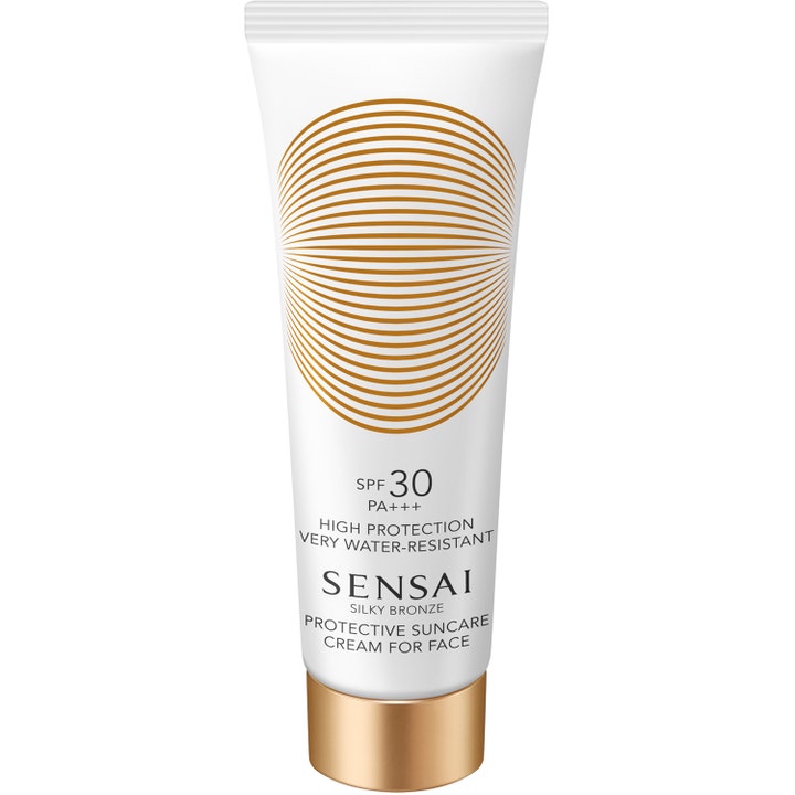 Sensai Silky Bronze SPF 30 vattentålig solkräm för ansiktet i vit tub med guldlock och dekorativt mönster.