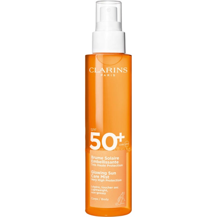 Clarins Glowing Sun Care Mist SPF 50+ 150ml icke-kladdig solspray kropp i orange genomskinlig sprayflaska