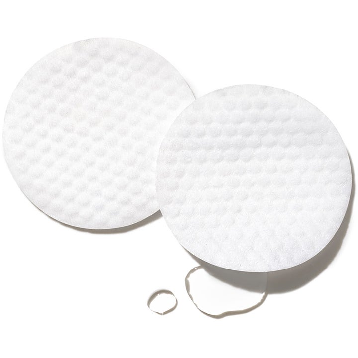 Exuviance Performance Peel AP 25 26 pads AHA peeling pads för hudförnyelse med vita mönstrade rondeller och klar vätska.