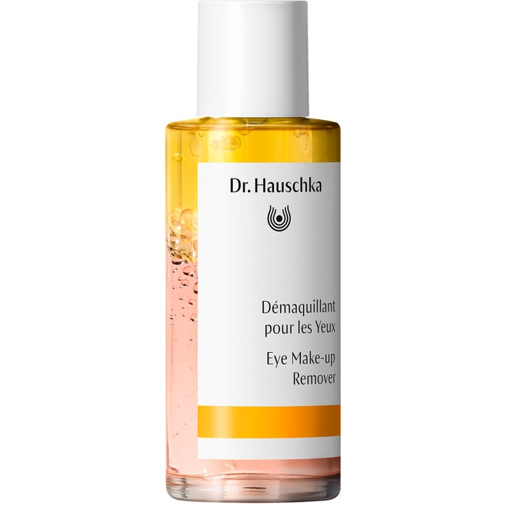 Dr. Hauschka ögonsminkborttagning 75 ml rengör milt i en genomskinlig flaska med gul tvåfasformula och vitt lock.
