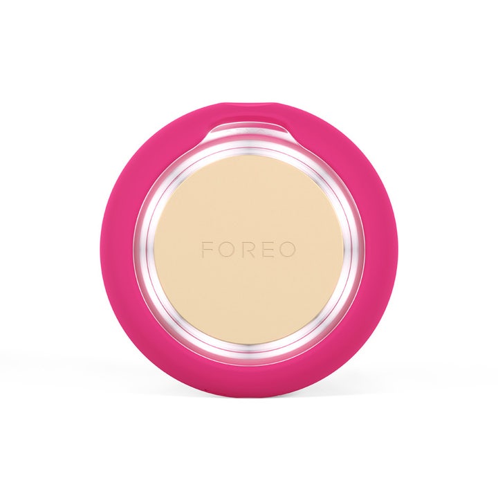 FOREO UFO 3 mini Fuchsia 1 st för ansiktsvård visar den runda apparaten med rosa silikonhölje och ljusbehandling