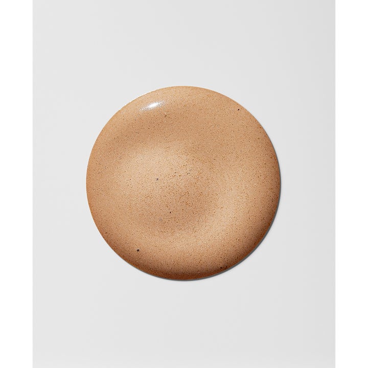 Heliocare Water Gel Color Beige 50 ml solkräm för ansiktet med lätt tonad krämig textur i en rund klick.